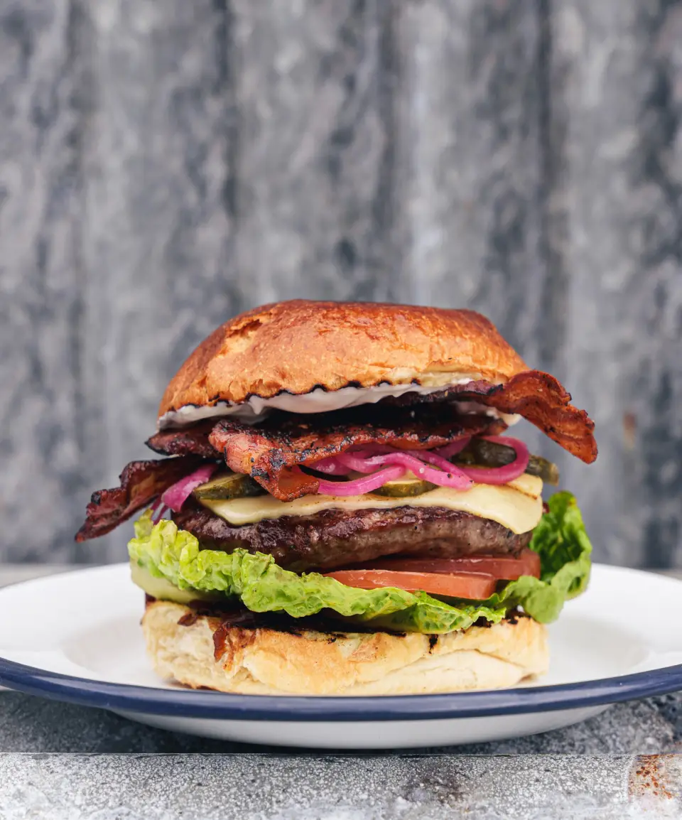 Proper Kitchen stacked cheese and bacon burger