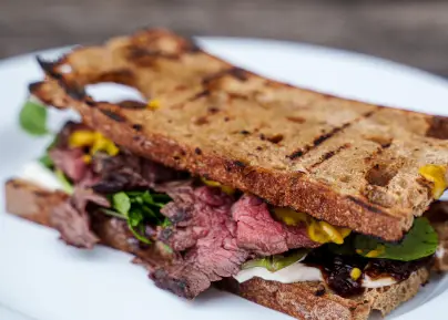 Pink roast beef sandwich on sourdough bread