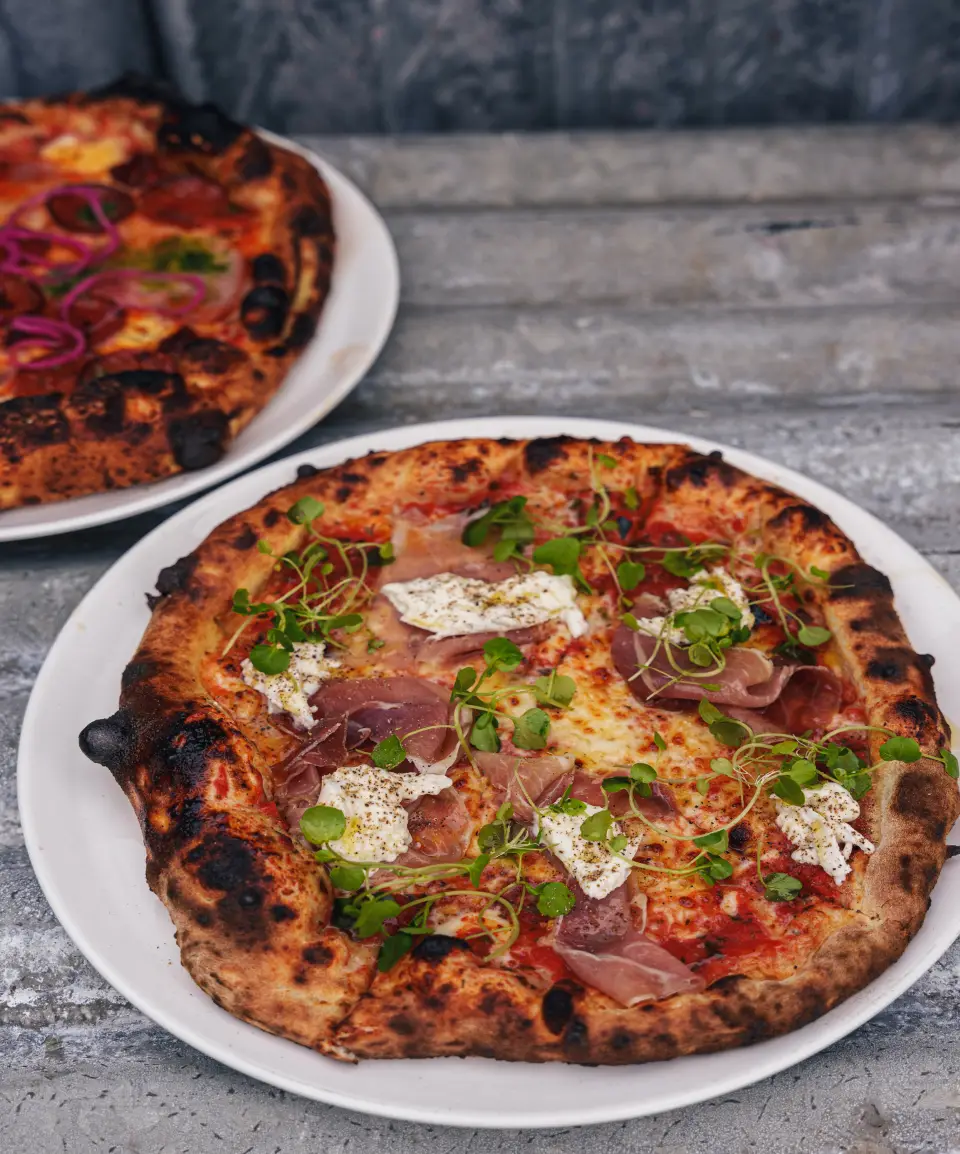 Wood Fired pizzas on plates